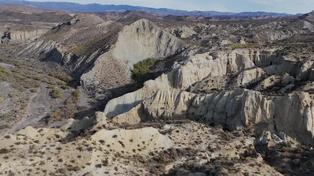 Cinematic Aerial View: The Arid, Dry Terrain of the Tabernas Desert, Andalusia, Illustrating Growing Desertification in Southern Spain