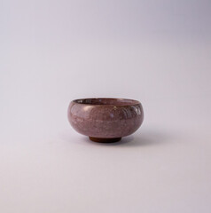 Single stone bowl on clean neutral background