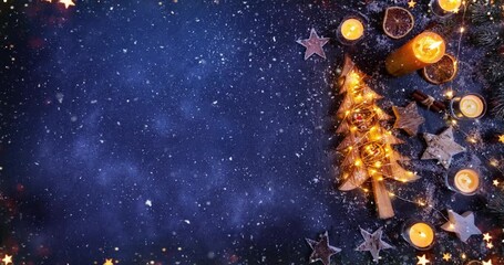 Cozy Christmas decorations arranged on dark black stone with gentle falling snow creating a festive winter atmosphere. Ideal as a holiday background or seasonal backdrop. - Powered by Adobe