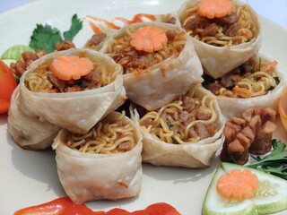 Fried wonton noodles are noodles with a chewy texture, seasoning that tends to be savory (salty), and crispy fried wonton and chicken toppings.