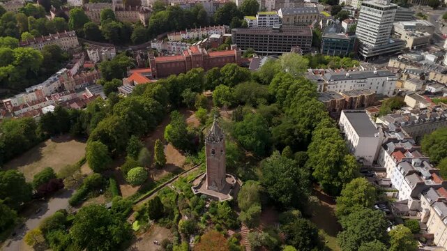 Bristol UK: 28th July 2025: Breathtaking drone view of Cabot Tower surrounded by lush greenery of Brandon Hill park. With University of Law in background