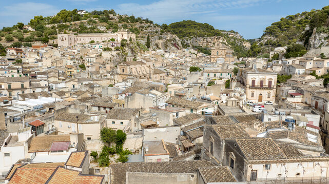 Aerial view of houses, buildings and roofs located in the historic center of the town of Scicli, in the province of Ragusa, Sicily, Italy. Ideal for the concept of an Italian village.