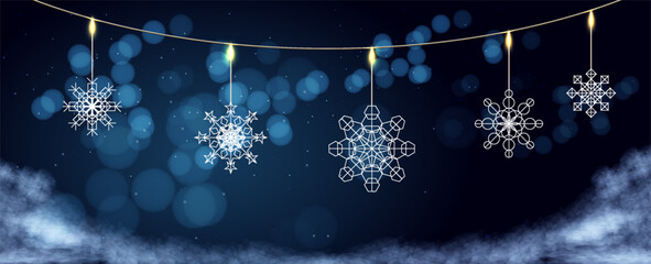 Decorative snowflakes hanging with glowing lights in a winter wonderland setting