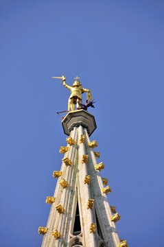 Gilded statue of the Archangel Michael fighting the dragon, the patron saint of the city of Brussels, on the 96 metre high late Gothic Belfry, City Hall, Grand Place, Brussels, Belgium, Benelux