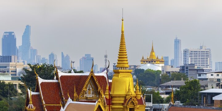 Wat Tri Thotsathep Worawihan, behind it Golden Mount and the skyline of Bangkok, Thailand