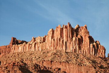 Vibrant Red Rock Cliff Band with Towering Natural Spires