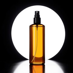 Amber spray bottle with black atomiser cap, circular light setup