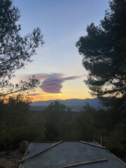 Beautiful cloud swirl above the mountains at sunset
