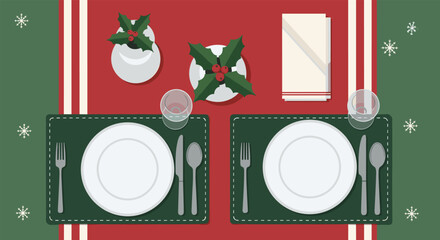 Top-down view of a festive Christmas dinner table setting for two with plates, holly, and snowflake decorations.