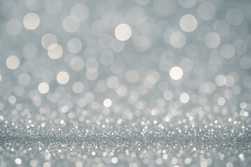 Silver bokeh background with shimmering sparkles and blurred lights