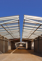 Interior View of Newly Built Market Hall with Steel Roofing Beams and Vendor Stalls in Gniezno Poland.  Modern Urban Bazaar for Retail Trade and Fresh Produce Sales