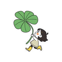 Joyful child running with a large four leaf clover silhouette