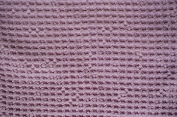 The texture of a waffle purple towel