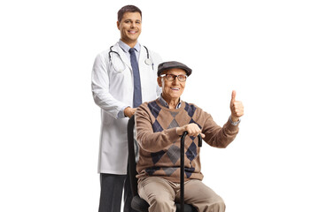 Satisfied elderly male patient gesturing thumbs up and sitting in a chair