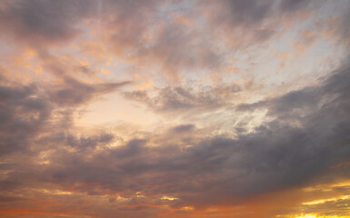 Obraz premium Orange sky and clouds in a bright morning,Orange clouds and morning sky,Real majestic sunrise sundown sky background with gentle colorful clouds without birds. Panoramic, big size.