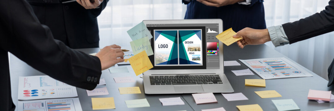 Graphic designer software for modern design of web page and commercial brisk ads showing on the computer screen