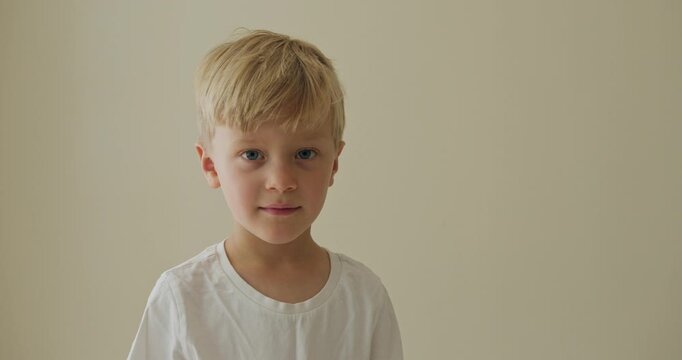 Young kid exploring softly illuminated, an ignorant youngster bathed in subtle illumination showing calm curiosity and innocent discovery