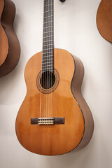 Obraz premium Classical Spanish Guitar Hanging on Wall