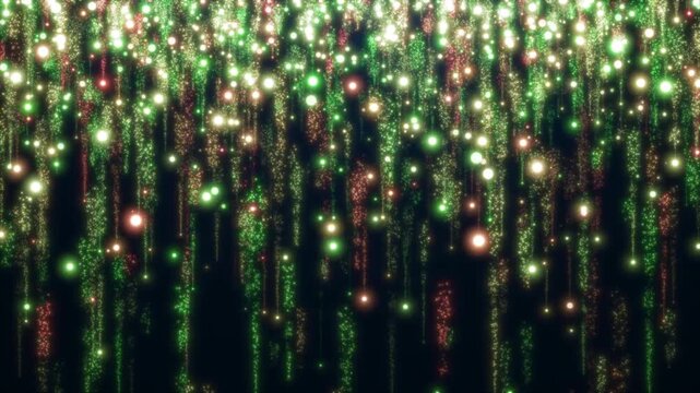 軌跡を描き落下する光の粒のループ背景 赤黄緑3色 (クリスマスカラー)