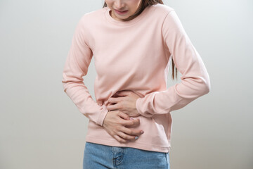 Flatulence asian young woman intolerance hand in stomach ache, suffer from food poisoning,...