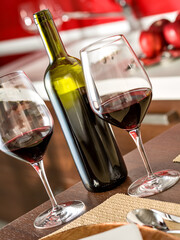 Wine and Table Setting with Red Accents in Modern Kitchen