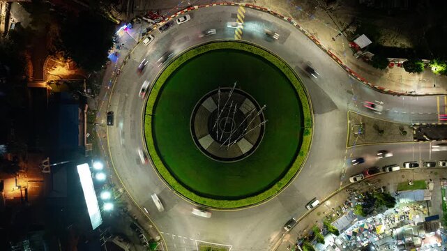 night time illumination penang island george town traffic street circle art installation aerial topdown panorama 4k timelapse malaysia