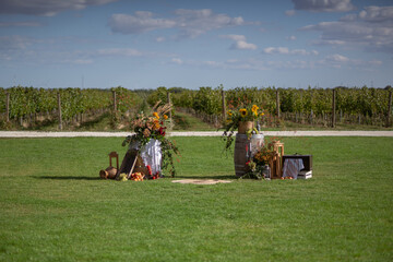 Rustic Outdoor Wedding Setup in Vineyard With Floral Decorations