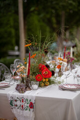 Elegant Outdoor Wedding Table With Floral Centerpieces and Glassware