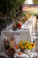 Elegant Outdoor Wedding Table With Floral Centerpieces and Glassware