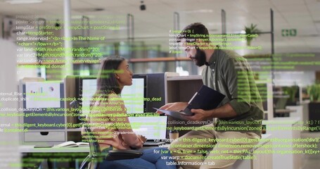 Pointing at monitors, two team members in casual clothes holding tablet in open office code overlay