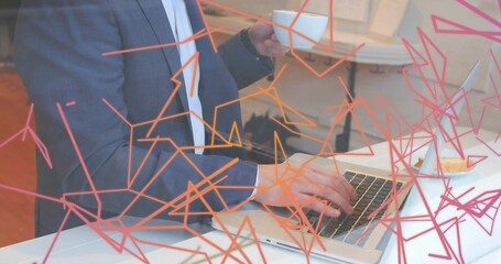 Typing man wearing gray blazer on laptop in cafe, holding cup and pastry with orange-pink overlays