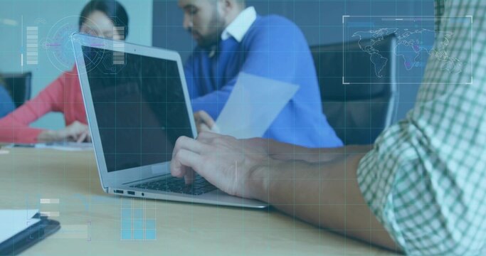 Typing person wearing green checked shirt using silver laptop at conference table with HUD overlay