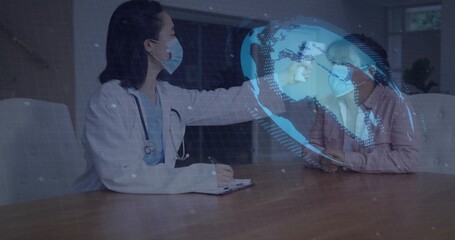 Reaching doctor wearing lab coat and stethoscope consulting masked patient at clinic with hologram
