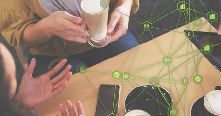 Discussing group holding lattes and devices on cafe table with green overlay mustard top gray scarf © vectorfusionart