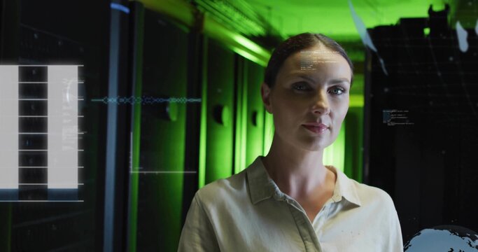 Standing woman in collared shirt studying HUD display in data center with server racks, green LEDs