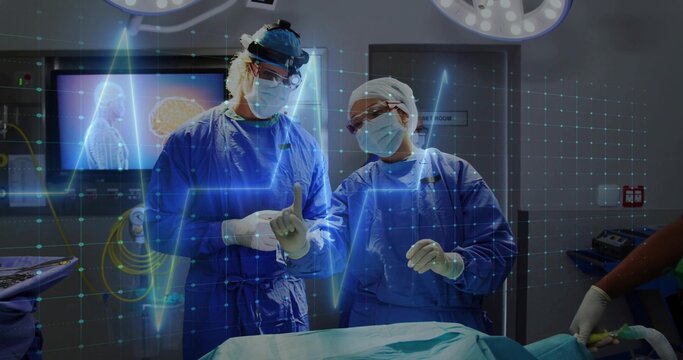 Operating two surgeons pointing and talking at hospital OR in surgical gowns with ECG overlay
