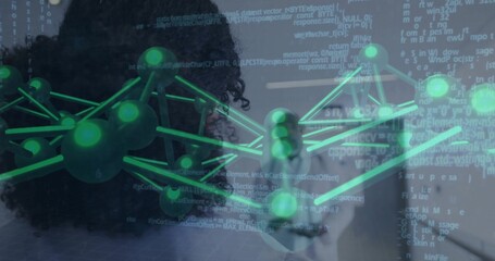 Viewing researchers in dark top and light blouse analyzing 3D network in lab, with code overlay