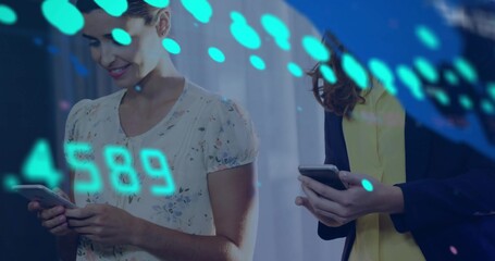 Holding phones, two coworkers in lobby, wearing floral blouse and blazer, teal overlay 4589