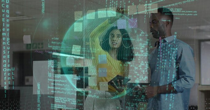 Gesturing yellow-top woman and man with tablet pointing at glass wall in office with holograms