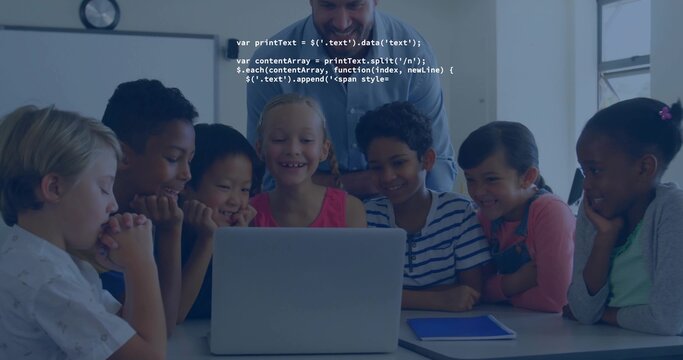 Gathering teacher and students leaning over laptop in classroom, with tablet and code overlay - Powered by Adobe