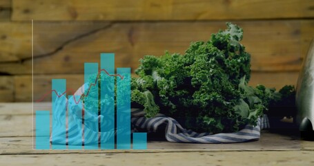 Displaying curly-kale on striped-cloth atop wood-table with turquoise-bars-and-red-line, copy space