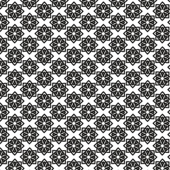 Intricate black and white geometric floral pattern with repeating starburst motifs and subtle textured background