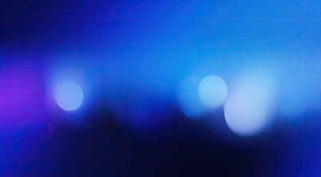 Abstract blue/purple blurry bokeh lights on a black background