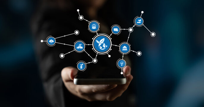 A hand holds a smartphone surrounded by digital icons, representing the integration of technology and communication in modern society. Ideal for tech-related concepts. Tessel