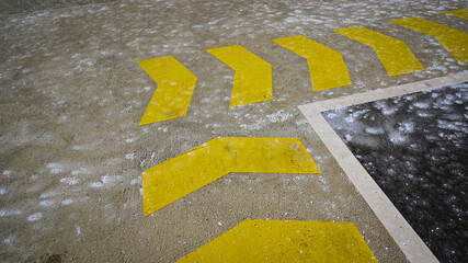 Yellow attention lines on a park deck 