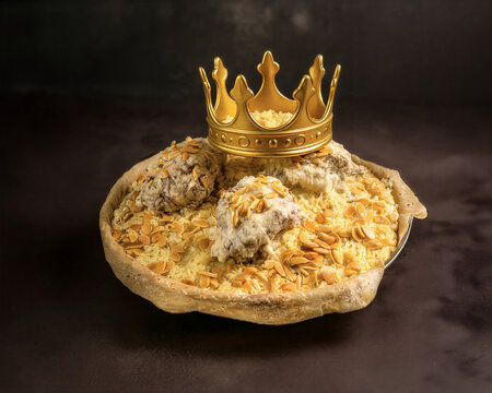 Creative conceptual image of Mansaf topped with a golden crown