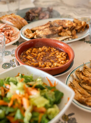 Close-Up of prawn al Pil-Pil on Family Dinner Table ready to eat, easy and Gourmet Seafood Dish recipe