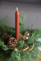 Christmas arrangements with candles and fir branches. Xmas decorations.