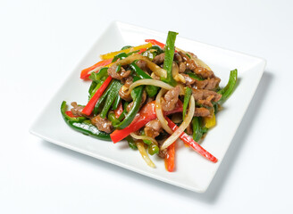 Savor the vibrant flavors of beef stir-fry with colorful peppers and onions. A delicious and healthy meal to promote Asian cuisine and culinary experiences.