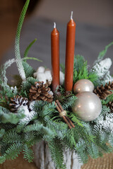 Winter Holiday Centerpiece With Pine Branches, Candles and Natural Decor